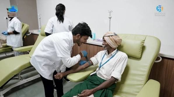 A health worker drawing blood from a patient at a clinic